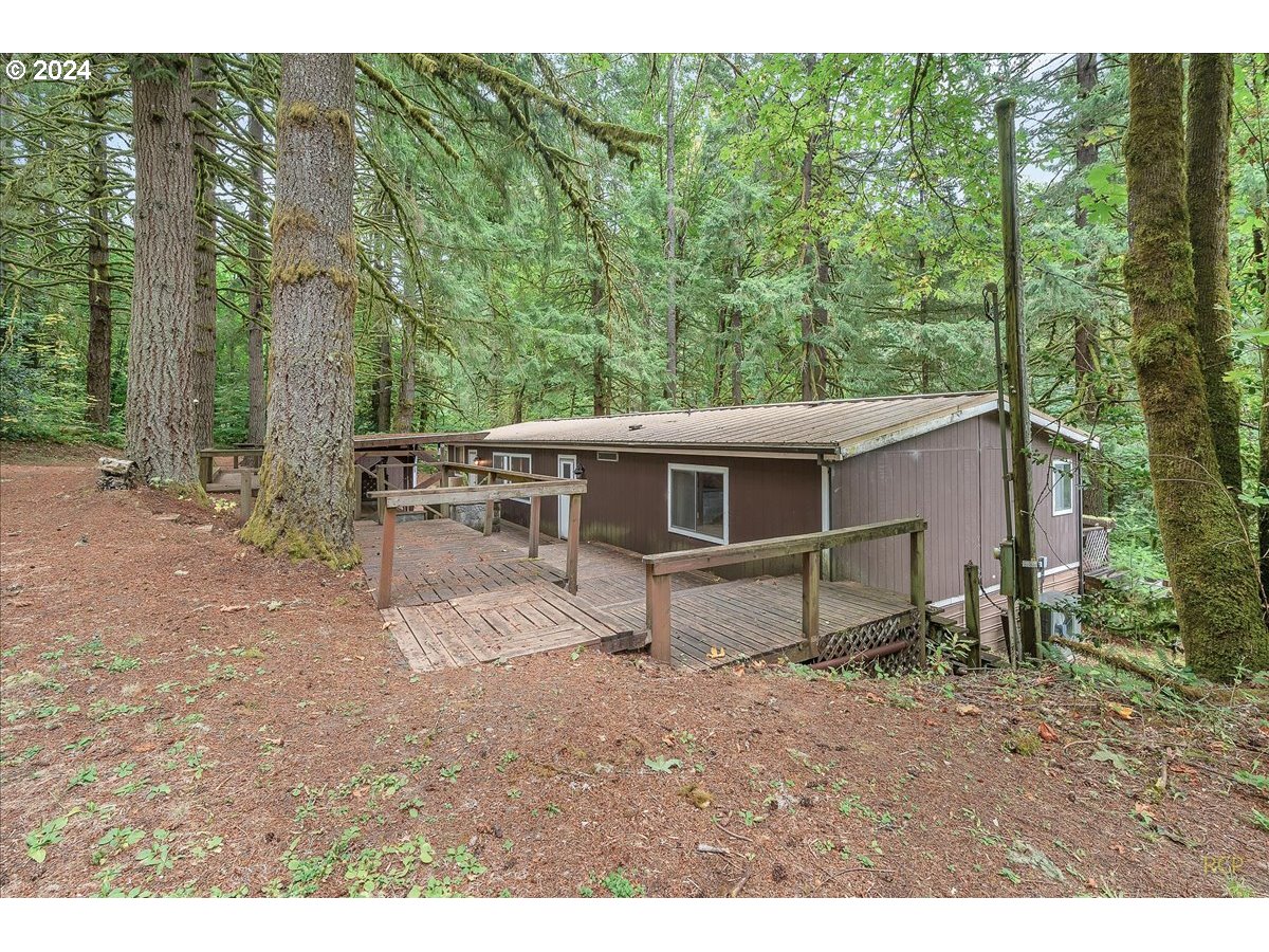 56925 Walker Road Scappoose, OR 97056 - Photo 4 of 40 a house view with a backyard space