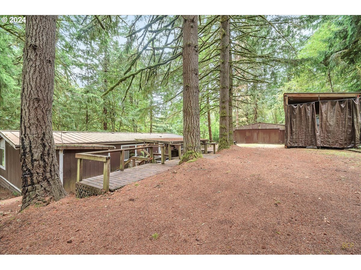 56925 Walker Road Scappoose, OR 97056 - Photo 6 of 40 a view of a house with a yard and an outdoor space