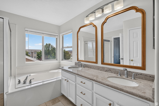 2223 North Pointe Meadow Loop Lehi, UT 84048 - Photo 23 of 56 Dual vanity featuring two undermount sinks, stone countertops, and gold-framed mirrors