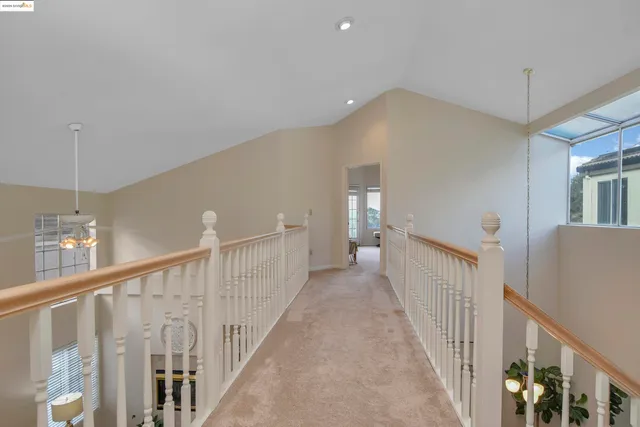 a view of a hallway with windows