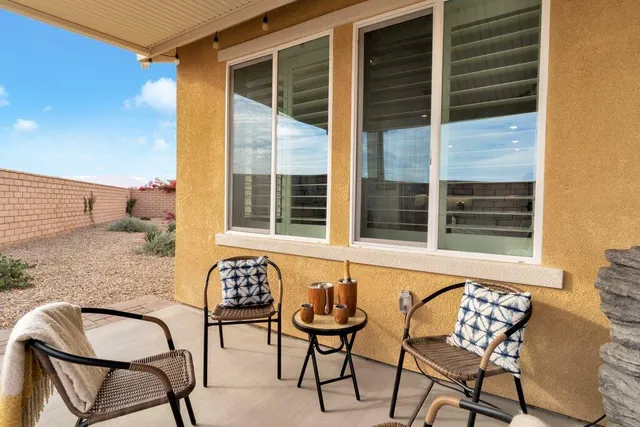 a outdoor dining space with furniture and outdoor view