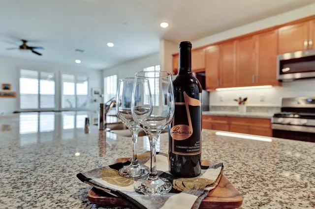 a kitchen with a stove a sink and a wooden cabinets