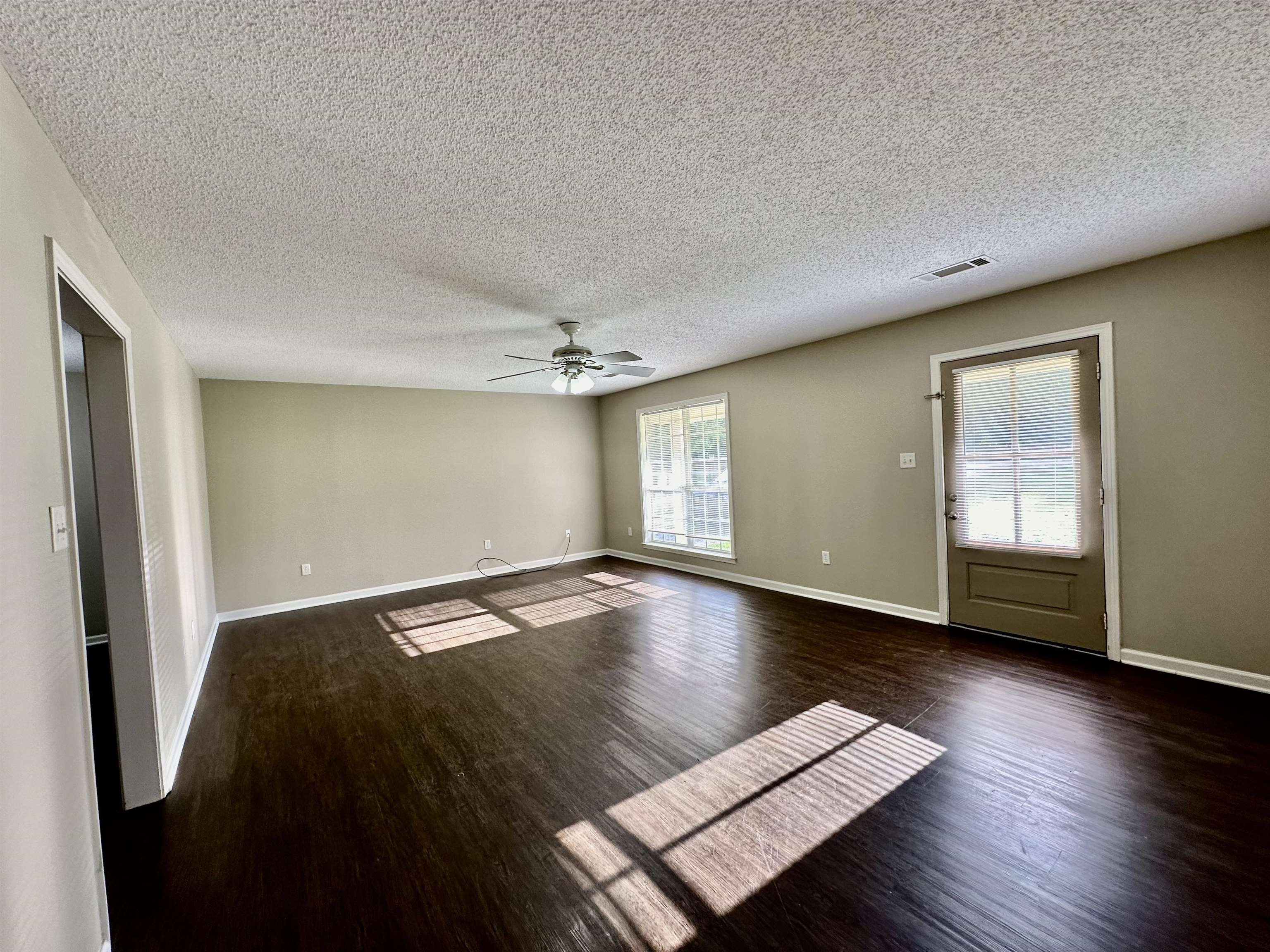 3536 Ray Bluff Road Millington, TN 38053 - Photo 4 of 17 an empty room with wooden floor and windows