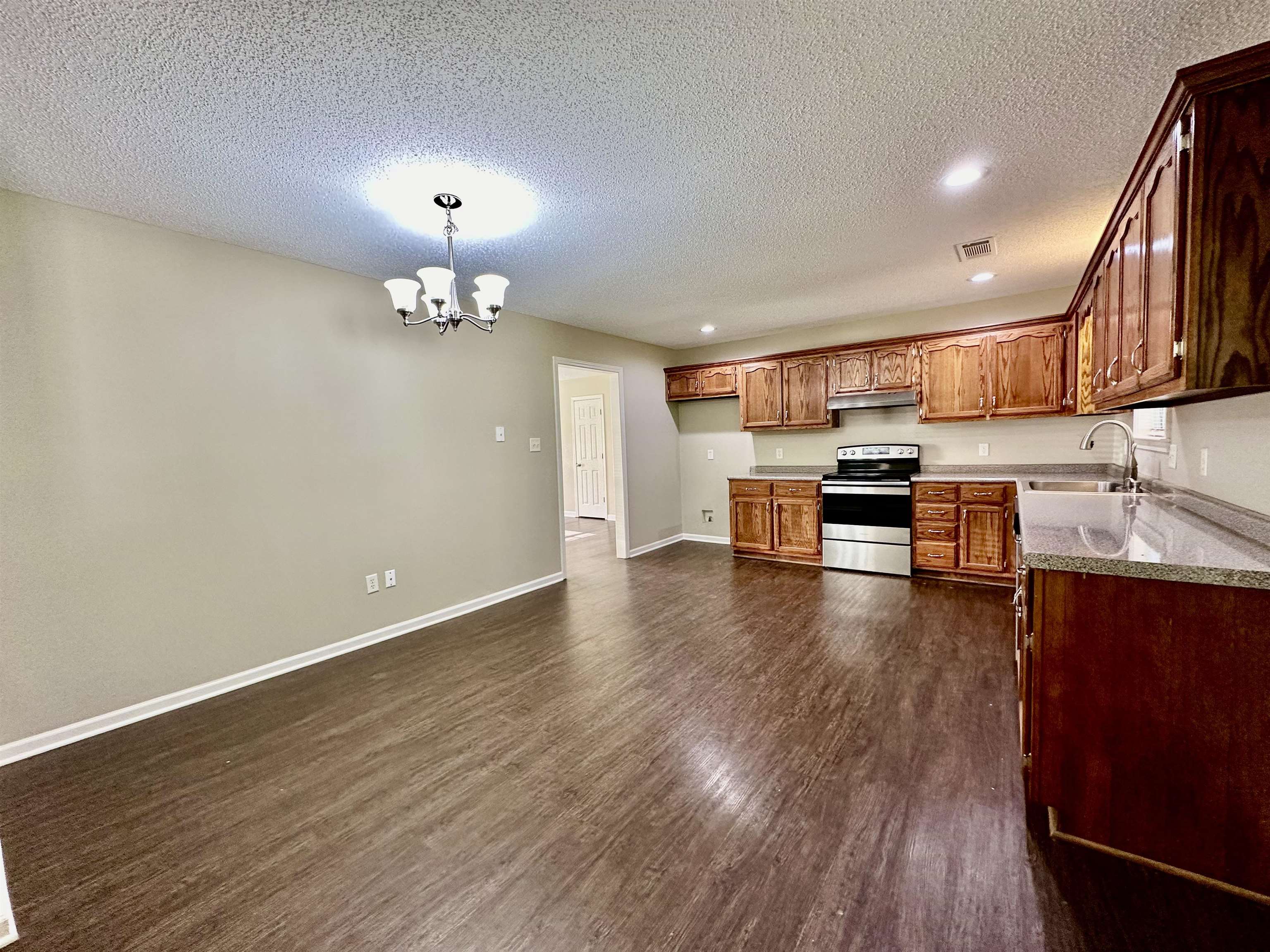 3536 Ray Bluff Road Millington, TN 38053 - Photo 8 of 17 a view of kitchen with stove and wooden floor