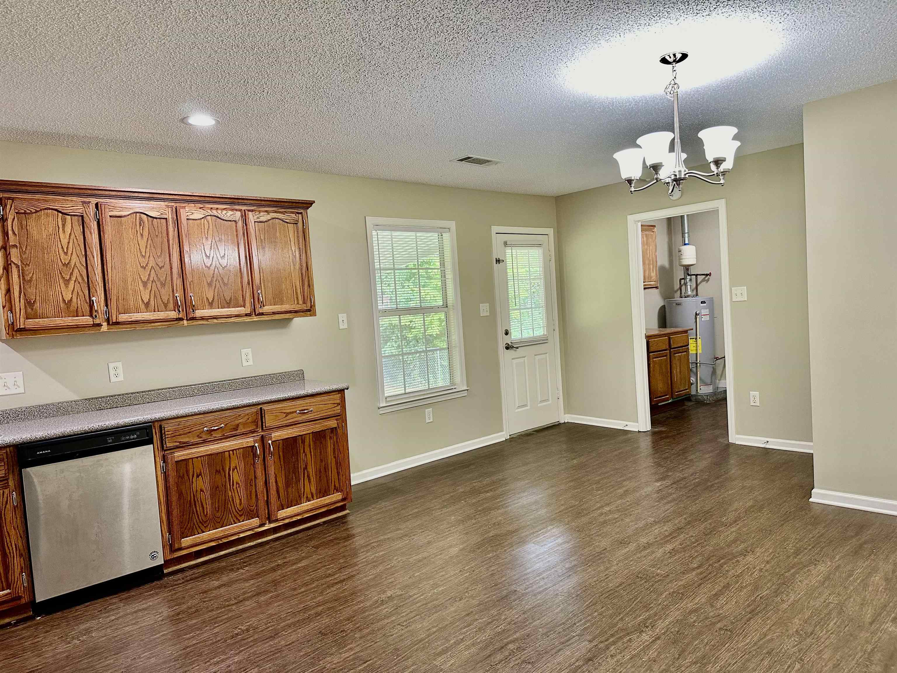 3536 Ray Bluff Road Millington, TN 38053 - Photo 9 of 17 a view of an empty room with window and wooden floor