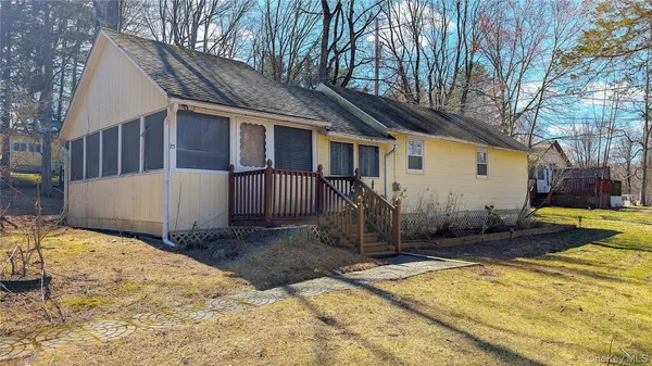 a view of a house with snow in the backyard
