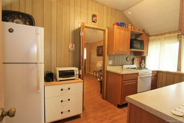 a kitchen with stainless steel appliances a refrigerator stove and sink