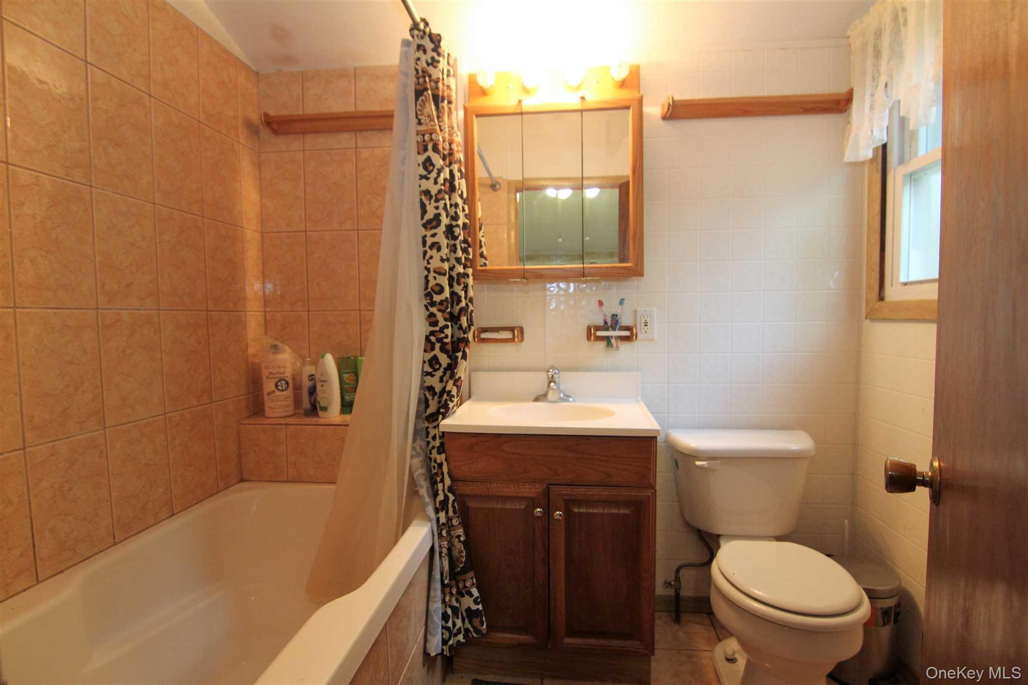 50 Glanhope Road, Unit 23 Hopewell Junction, NY 12533 - Photo 14 of 33 a bathroom with a sink a toilet and shower