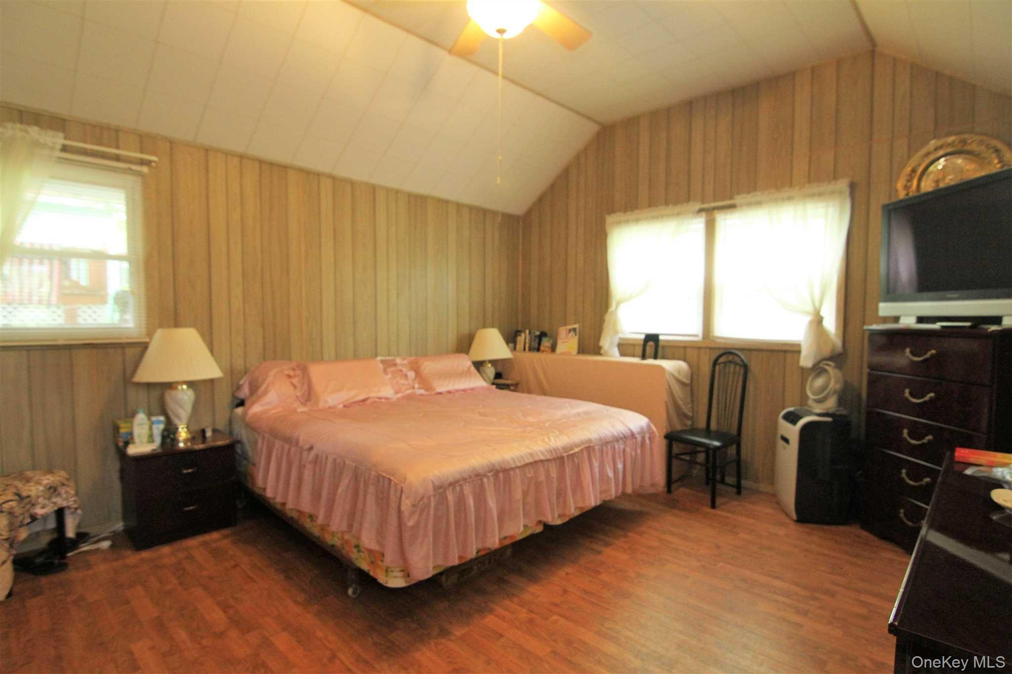 50 Glanhope Road, Unit 23 Hopewell Junction, NY 12533 - Photo 19 of 33 a bedroom with bed a flat tv screen and a dresser