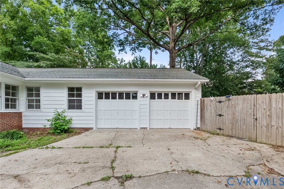 1136 Overbrook Road Petersburg, VA 23805 - Photo 42 of 51 Two-car garage with white panel doors and window i