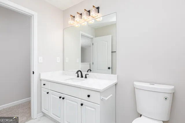 an empty room with a ceiling fan and window