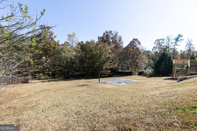 a view of a yard with trees