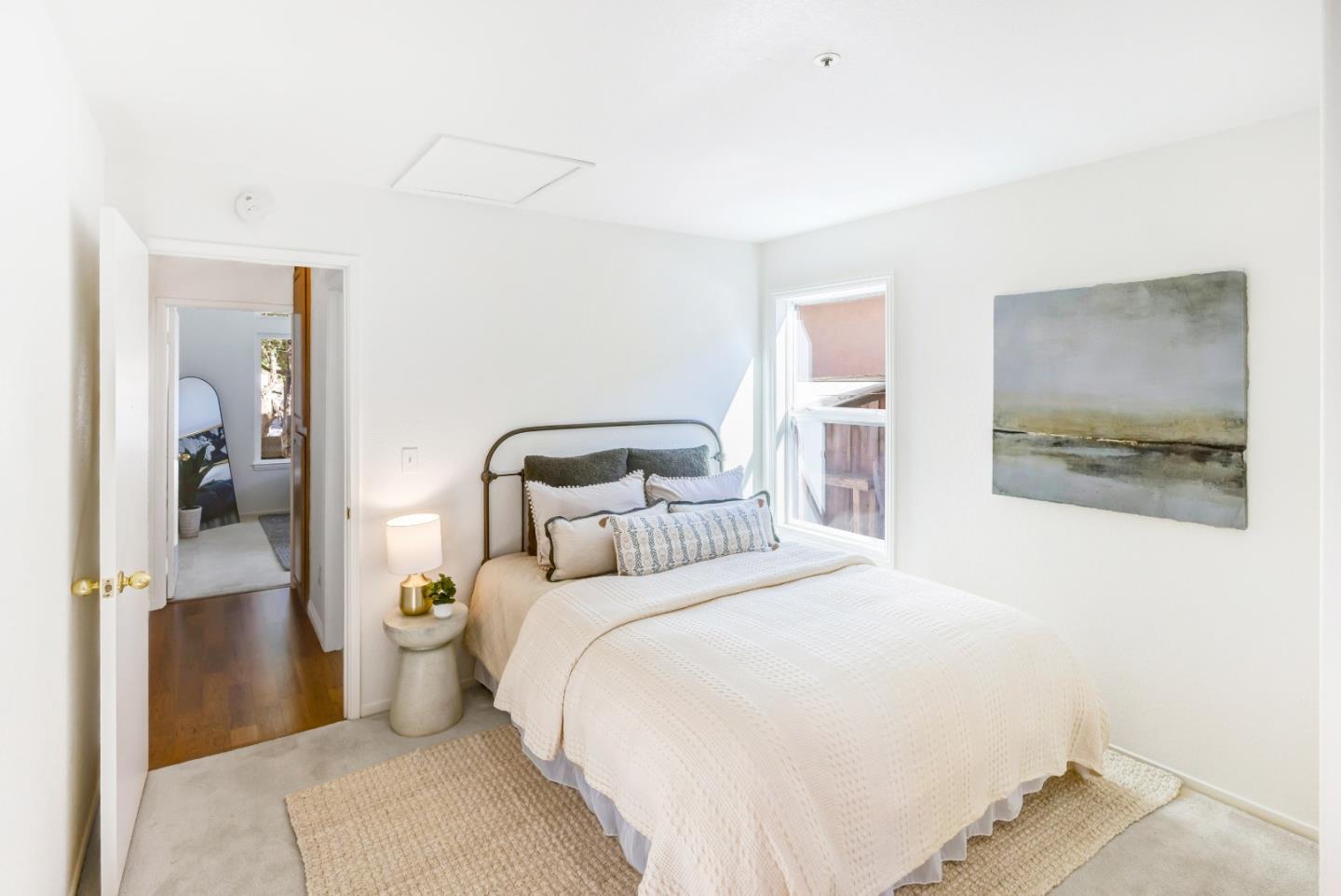 17602 Winding Creek Road Salinas, CA 93908 - Photo 14 of 15 a bedroom with a bed and a painting