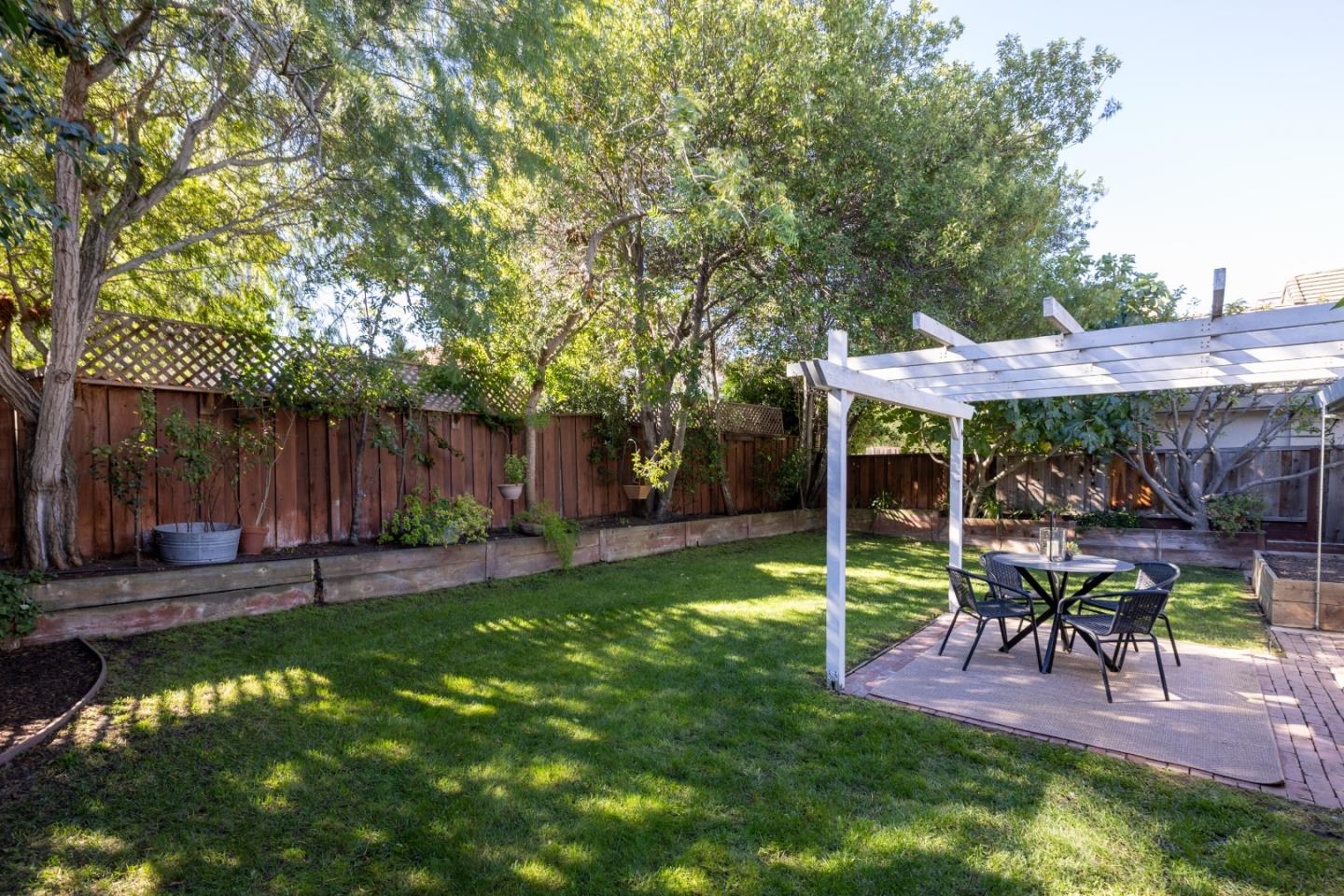 17602 Winding Creek Road Salinas, CA 93908 - Photo 15 of 15 a view of a chair and table in backyard of the house