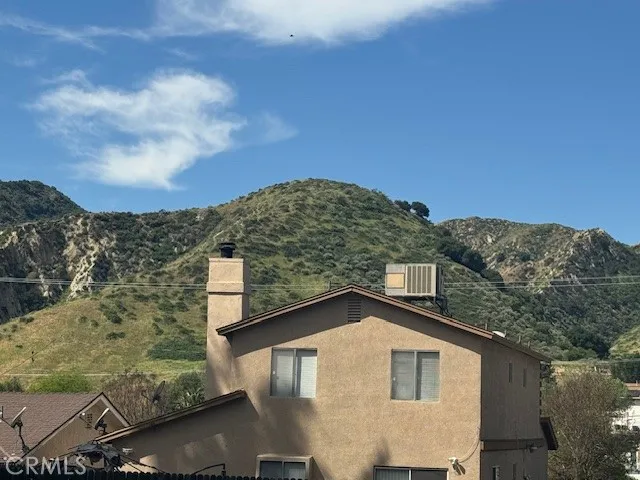 1 Garfield Val Verde, CA 91384 - Photo 10 of 11 a view of a house with a yard