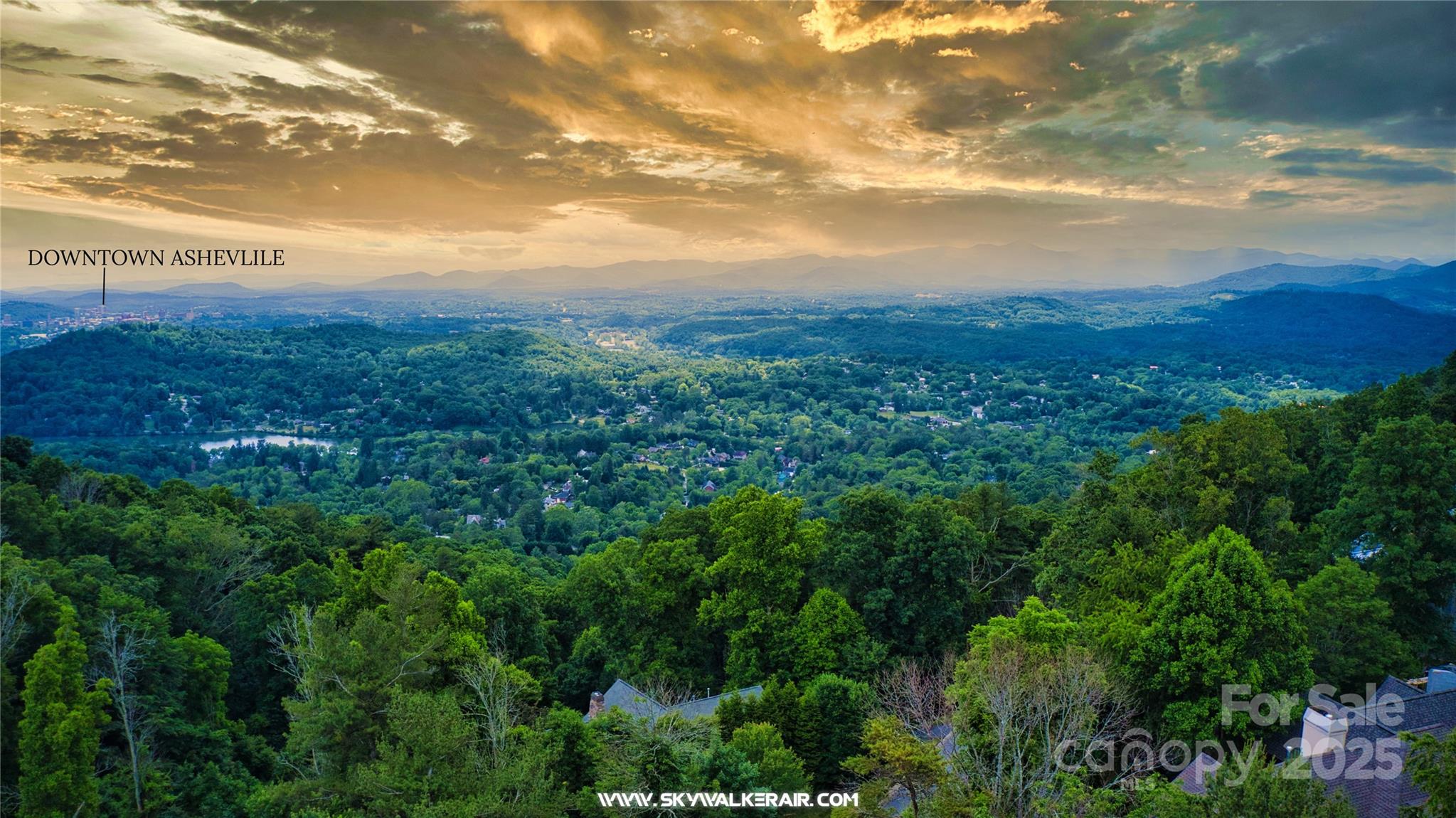 175 Senator Reynolds Road, Unit 23 Asheville, NC 28804 - Photo 3 of 5 a view of a city with lush green forest