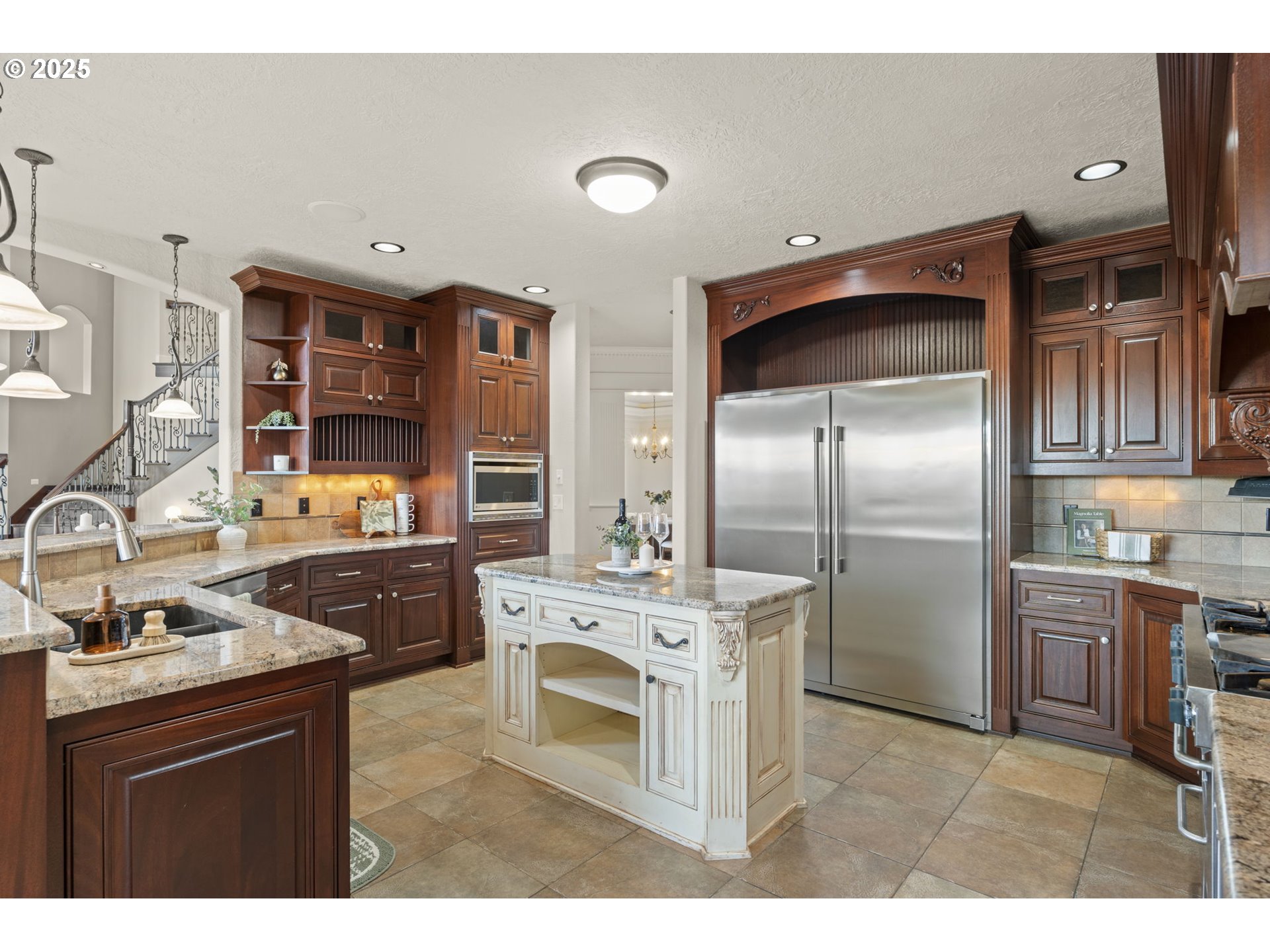 6035 Fernhill Loop Springfield, OR 97478 - Photo 12 of 48 a kitchen with stainless steel appliances granite countertop a refrigerator a stove and a sink with wooden cabinets