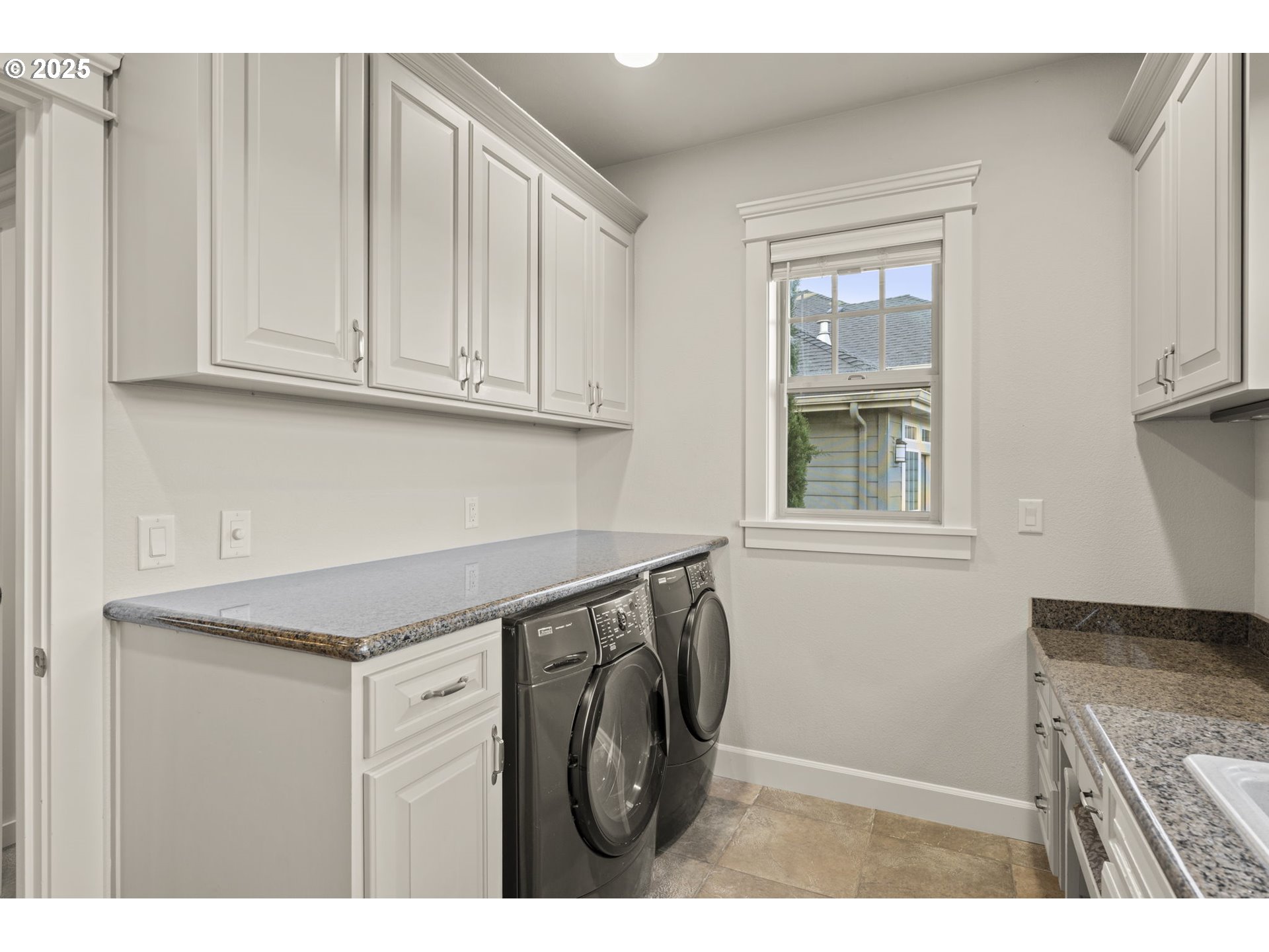 6035 Fernhill Loop Springfield, OR 97478 - Photo 18 of 48 a utility room with granite countertop a sink a washer and dryer