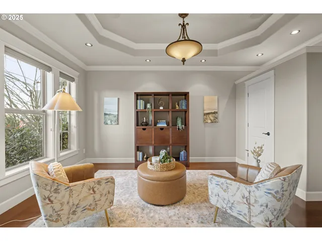 a bedroom with a bed a chandelier and a window