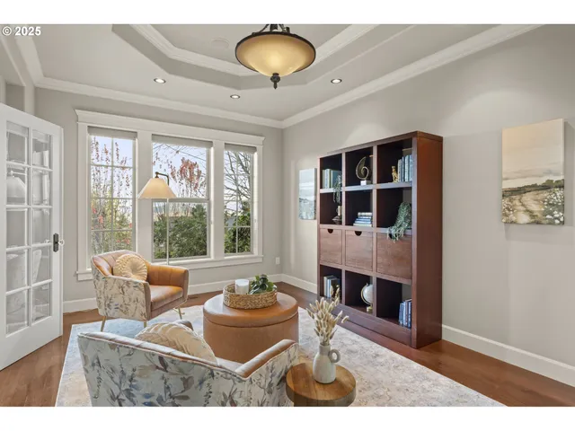a living room with furniture a window and a lamp