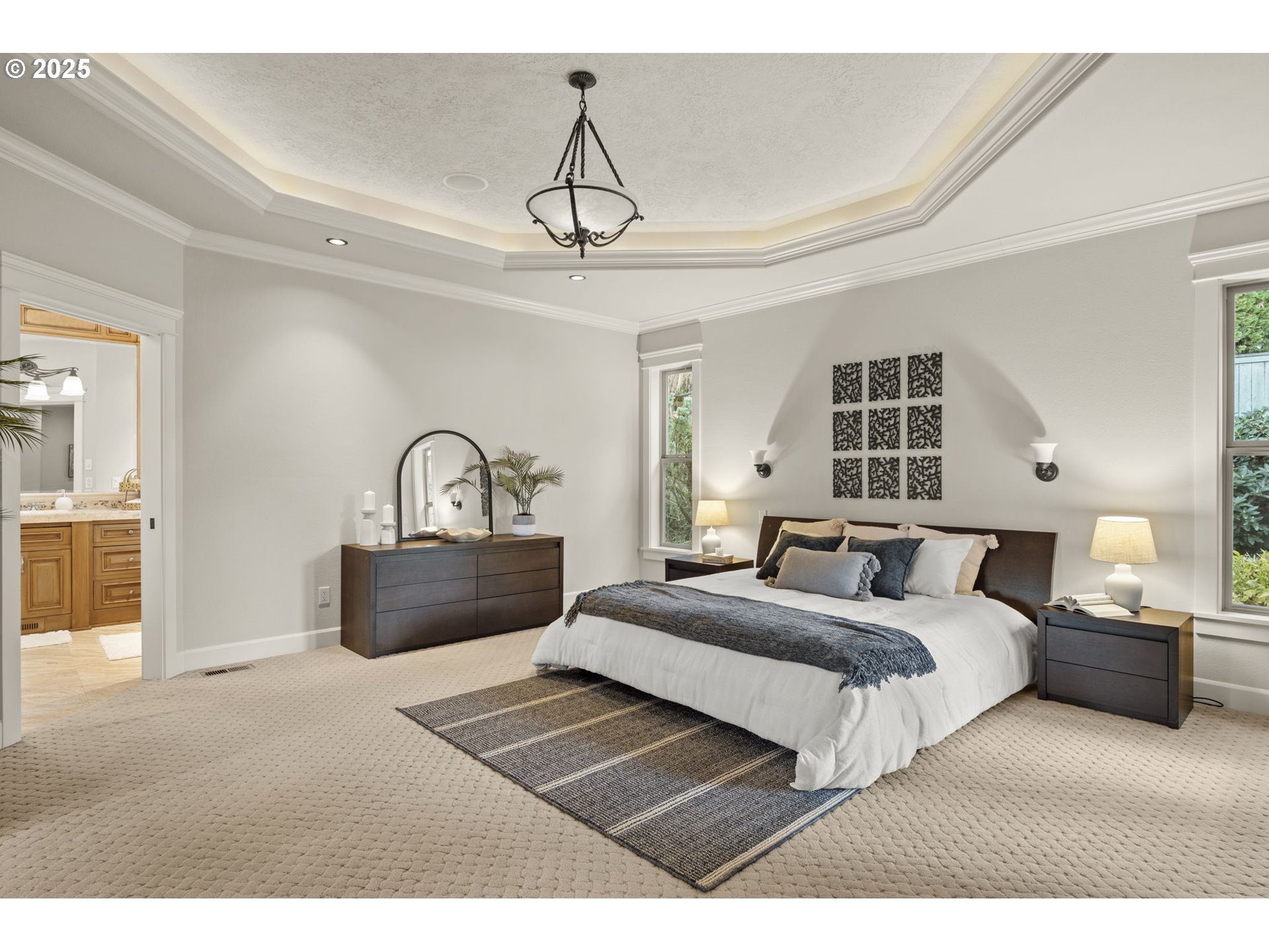 6035 Fernhill Loop Springfield, OR 97478 - Photo 28 of 48 a bedroom with a bed a chandelier and a window