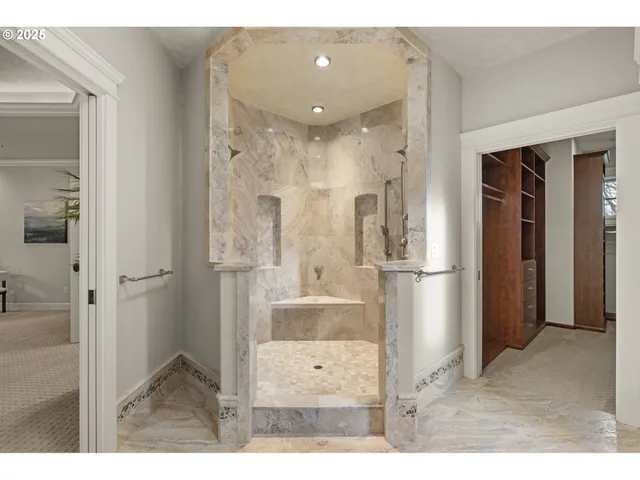 a kitchen with a sink window and cabinets