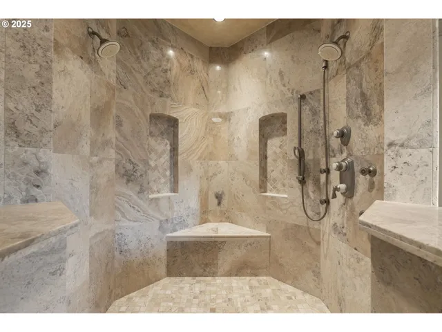 a living room with furniture and large windows