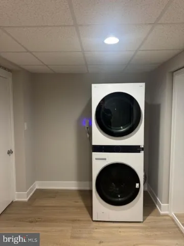 a view of a hallway with washer and dryer
