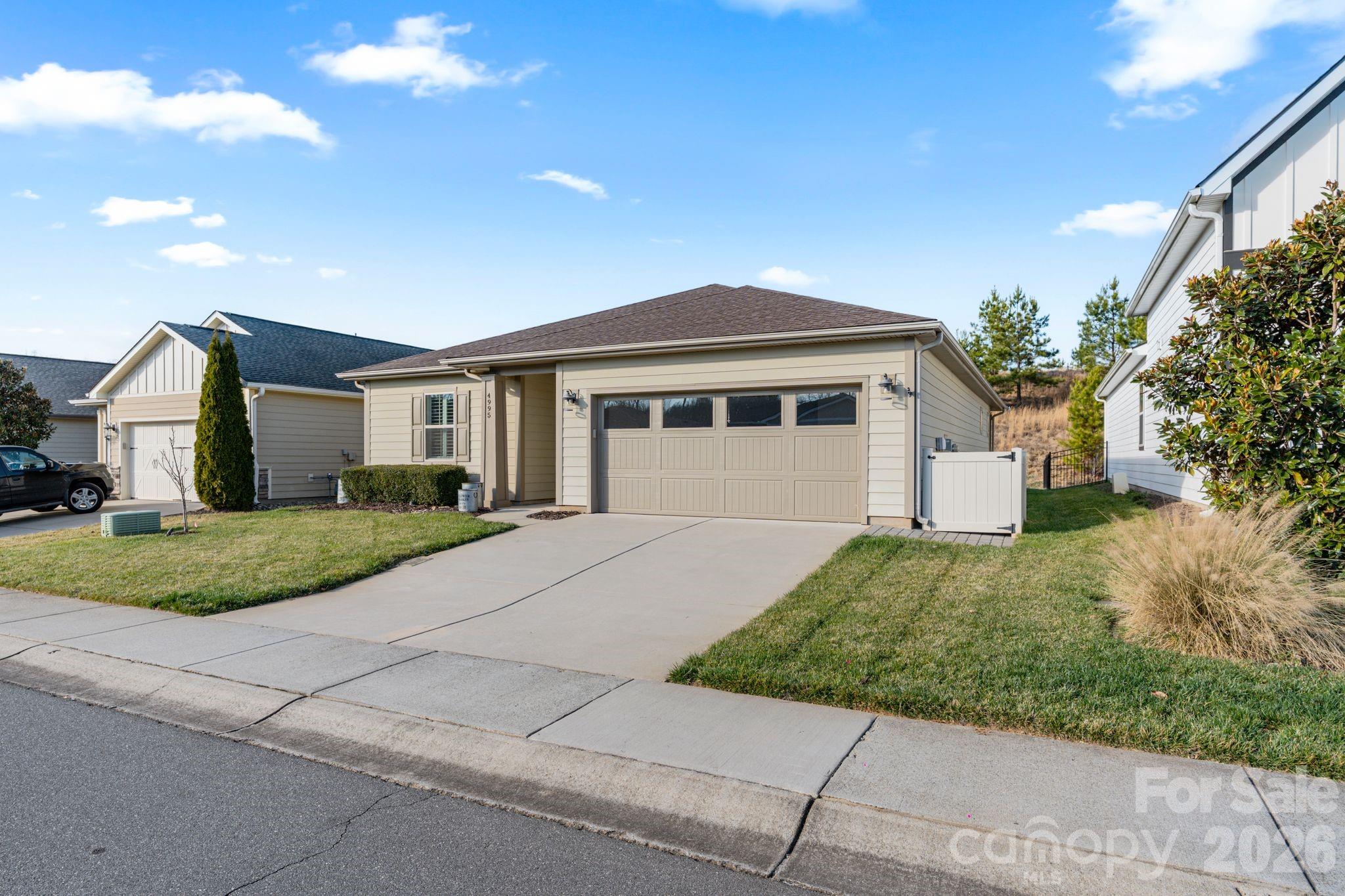 4995 Looking Glass Trail Denver, NC 28037 - Photo 2 of 46 a front view of a house with a yard and garage