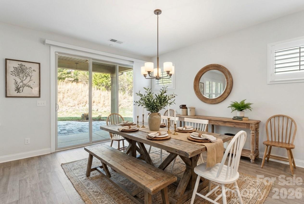 4995 Looking Glass Trail Denver, NC 28037 - Photo 21 of 46 a view of a dining room with furniture window and wooden floor