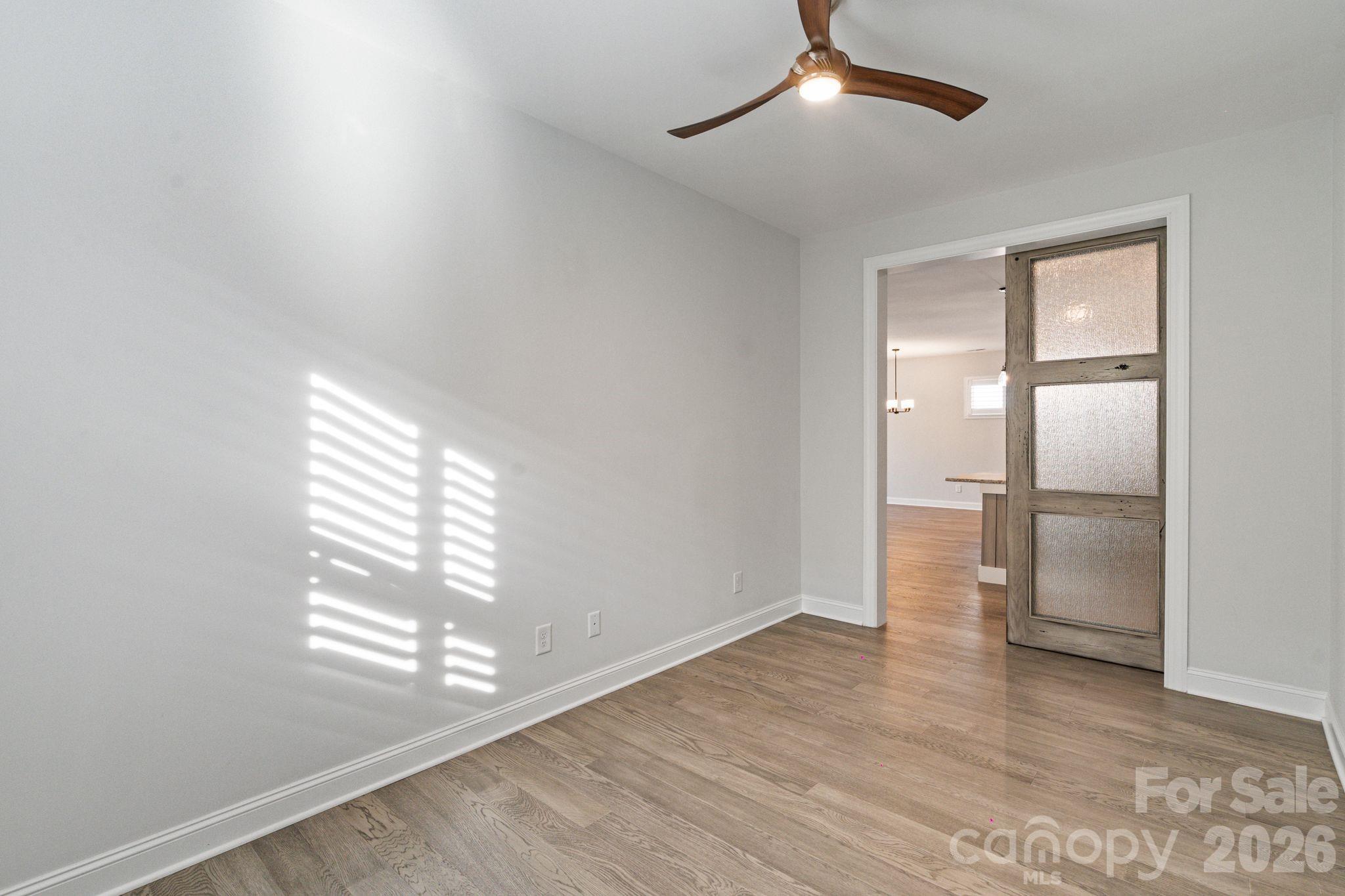 4995 Looking Glass Trail Denver, NC 28037 - Photo 24 of 46 wooden floor in an empty room with a window