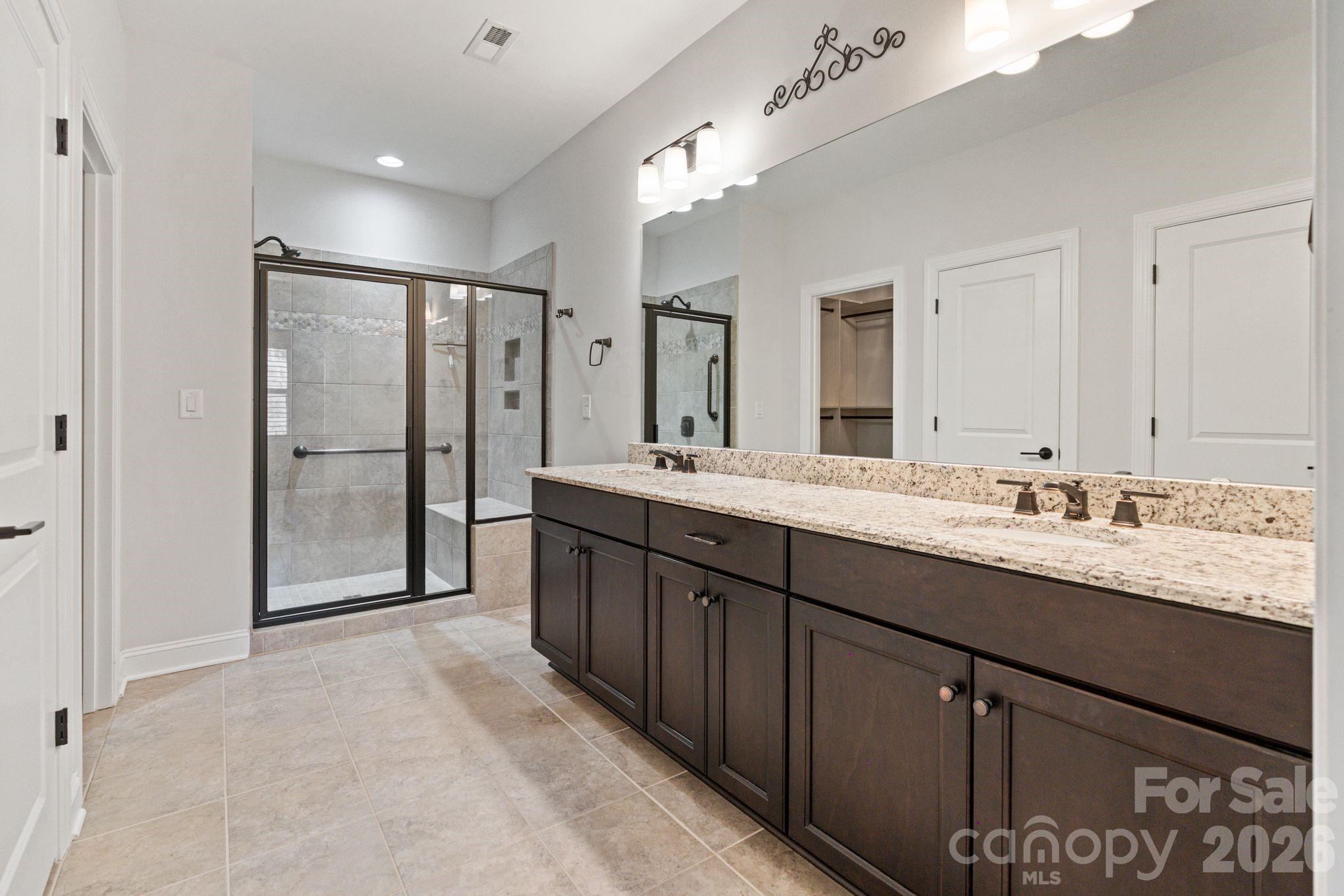 4995 Looking Glass Trail Denver, NC 28037 - Photo 28 of 46 a bathroom with a granite countertop sink mirror and double