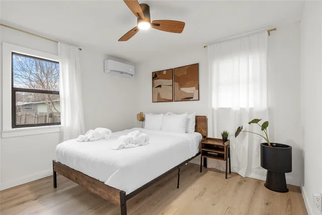 a bedroom with a bed and a table in it