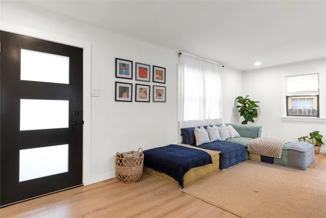 a bedroom with furniture and window