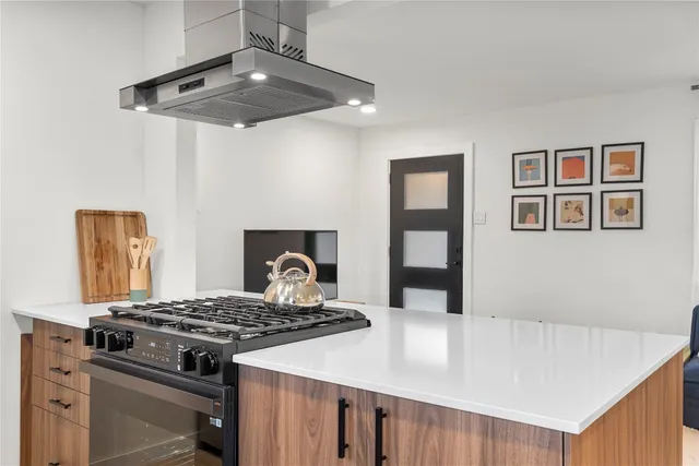 a kitchen with a stove and a refrigerator