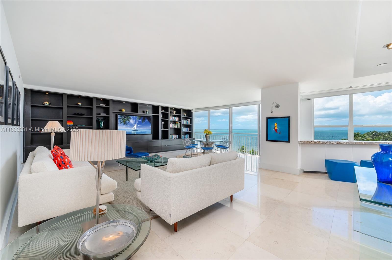 613 Ocean Drive, Unit 7C Key Biscayne, FL 33149 - Photo 2 of 42 a living room with furniture and a floor to ceiling window