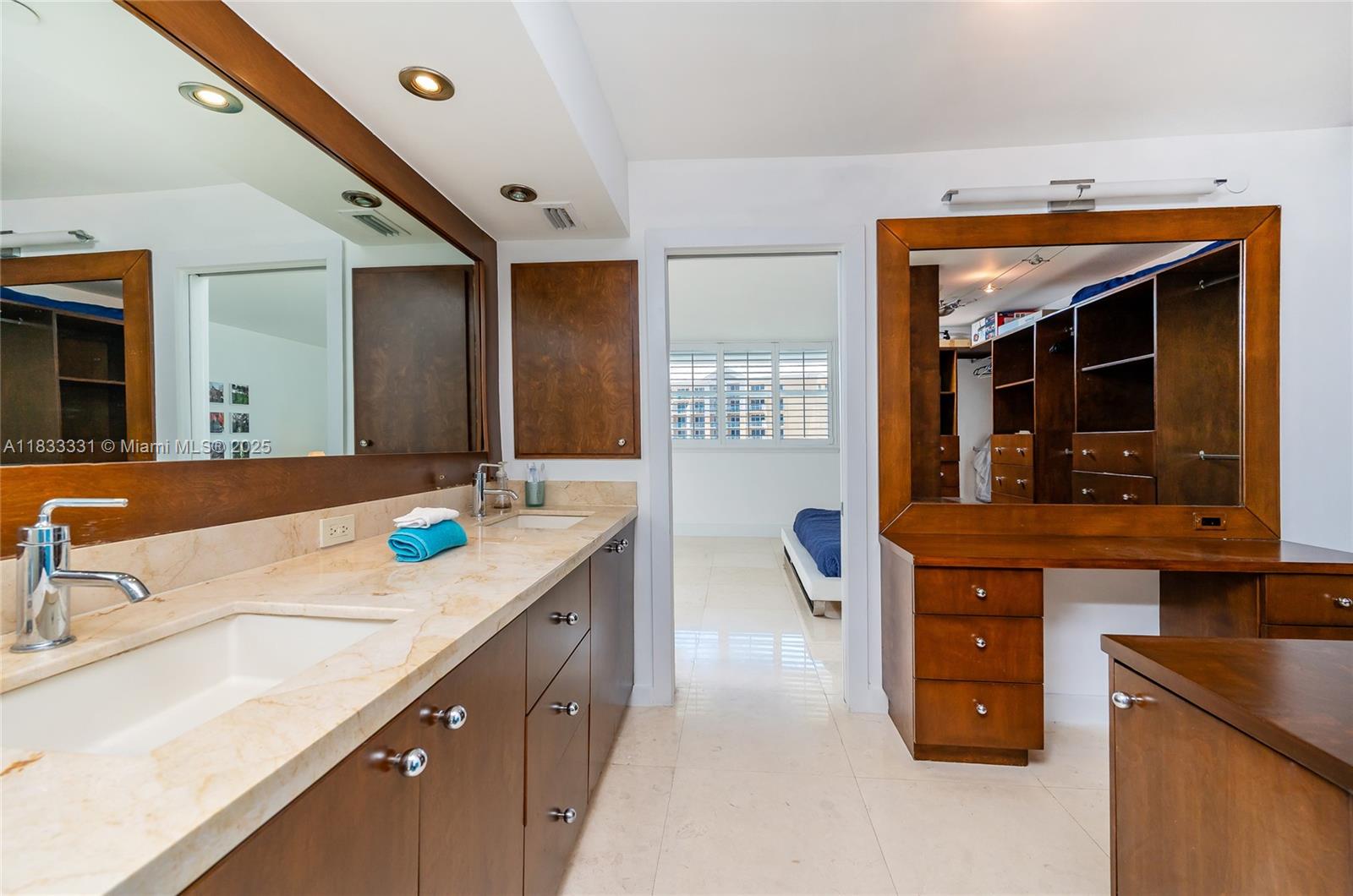 613 Ocean Drive, Unit 7C Key Biscayne, FL 33149 - Photo 23 of 42 a kitchen with kitchen island granite countertop a sink and a refrigerator