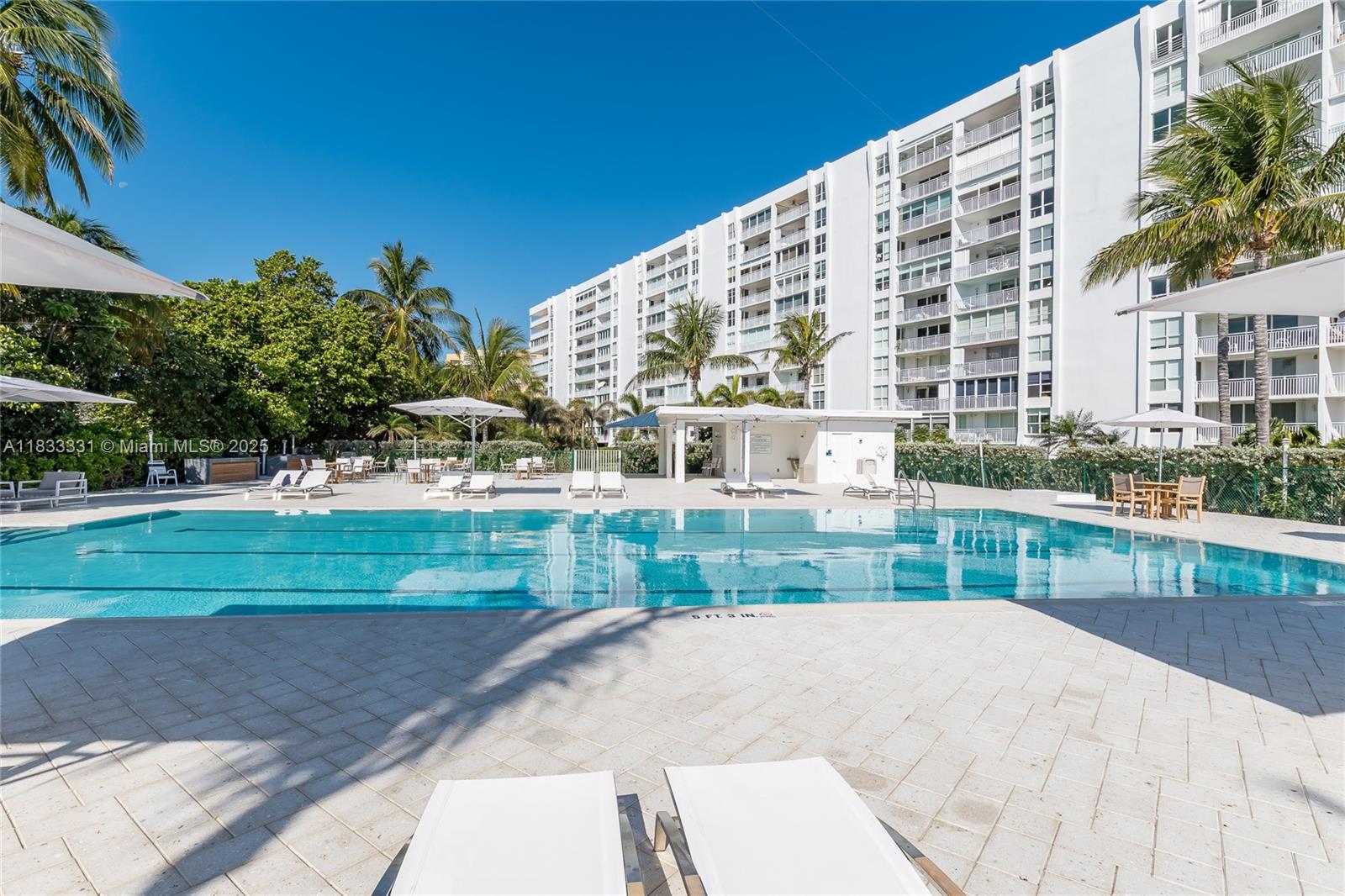 613 Ocean Drive, Unit 7C Key Biscayne, FL 33149 - Photo 33 of 42 a view of a house with a yard