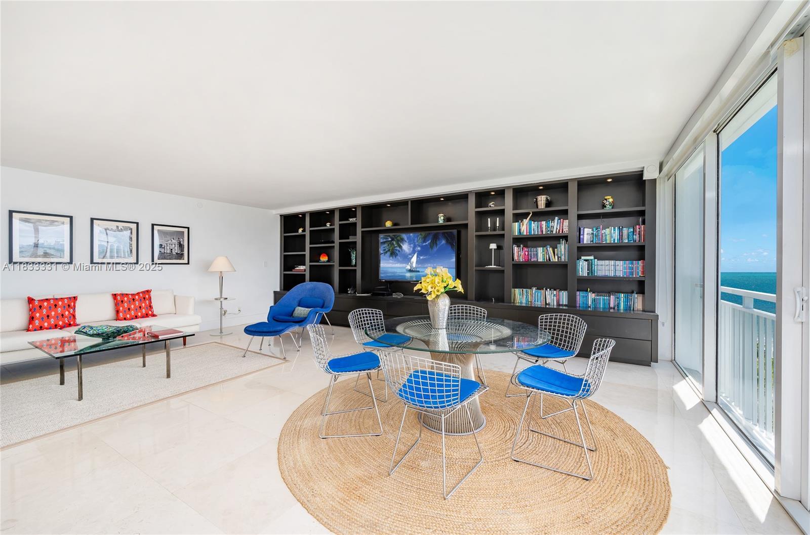 613 Ocean Drive, Unit 7C Key Biscayne, FL 33149 - Photo 6 of 42 a living room with furniture and a wooden floor