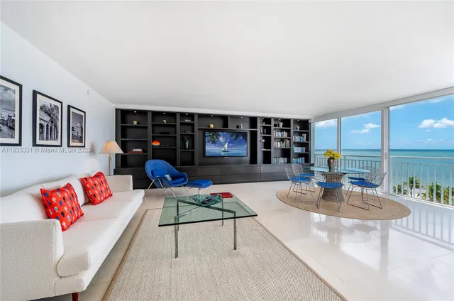 a living room with furniture and a table