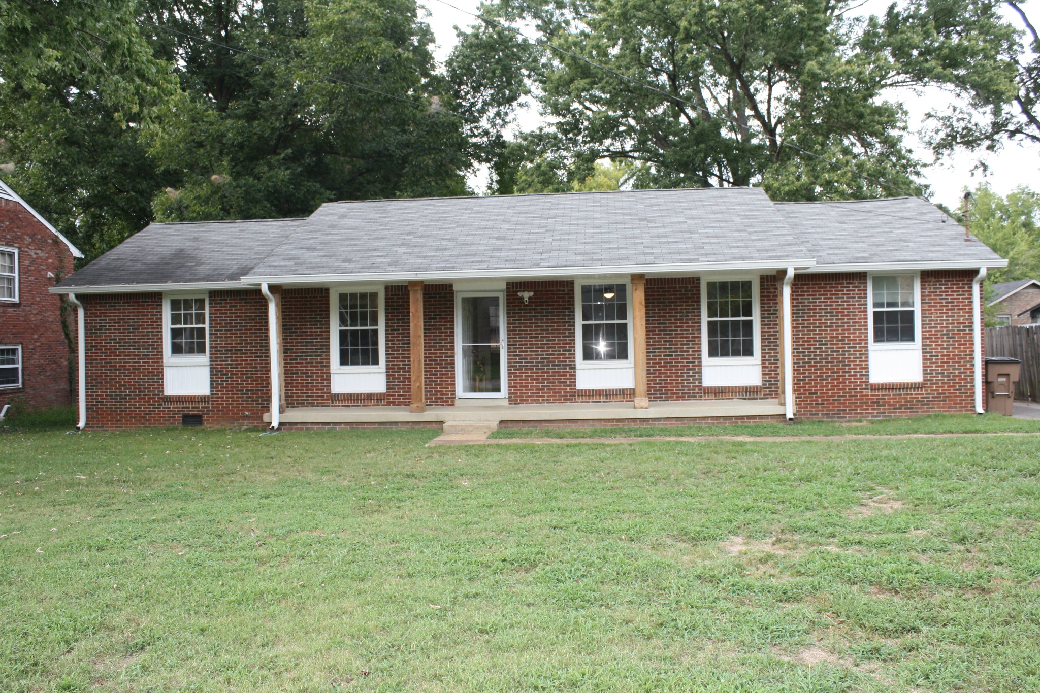 36 Benzing Road Antioch, TN 37013 - Photo 2 of 39 a house that has a big yard with wooden fence