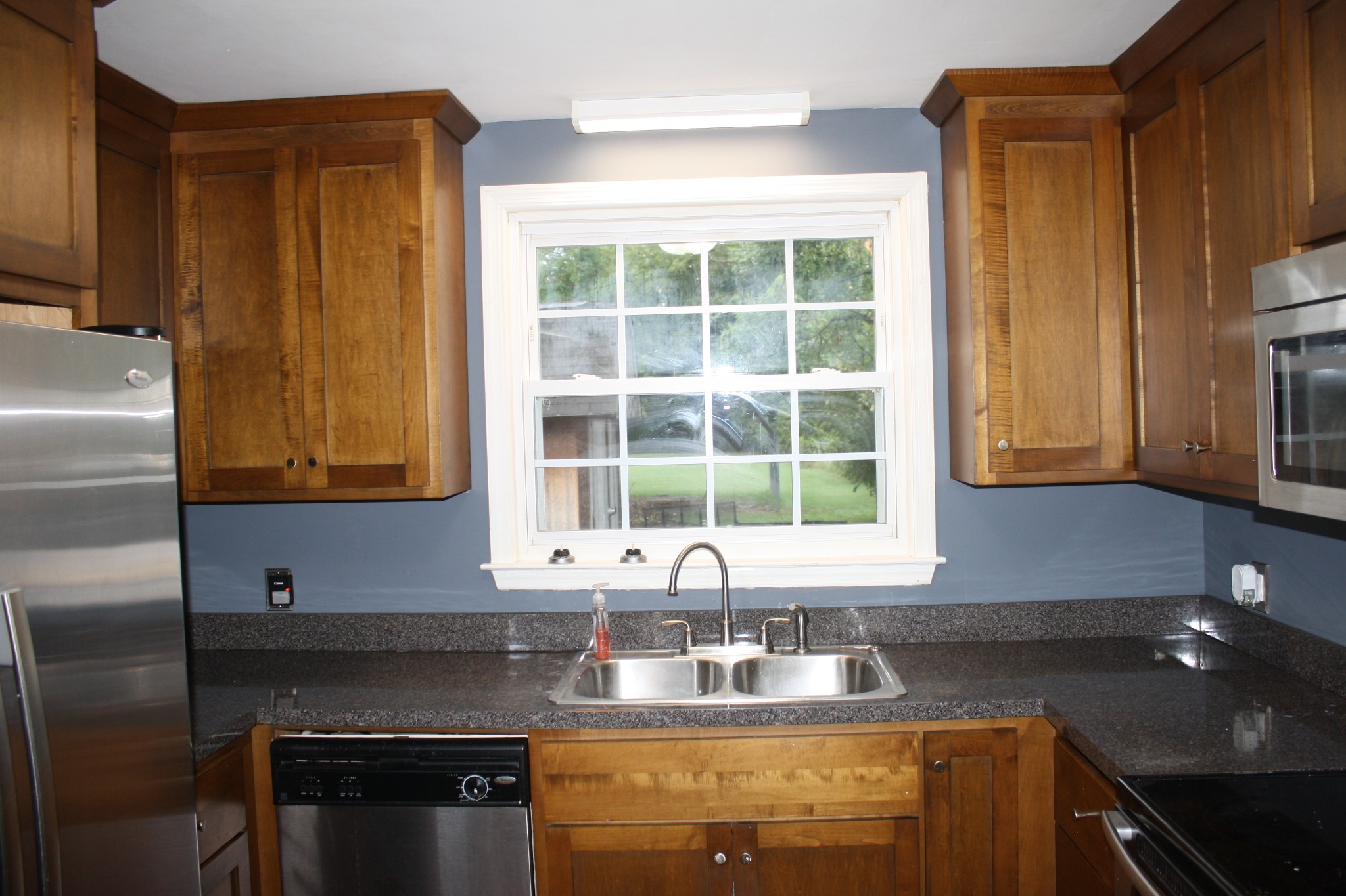 36 Benzing Road Antioch, TN 37013 - Photo 32 of 39 a kitchen with granite countertop a sink and a window