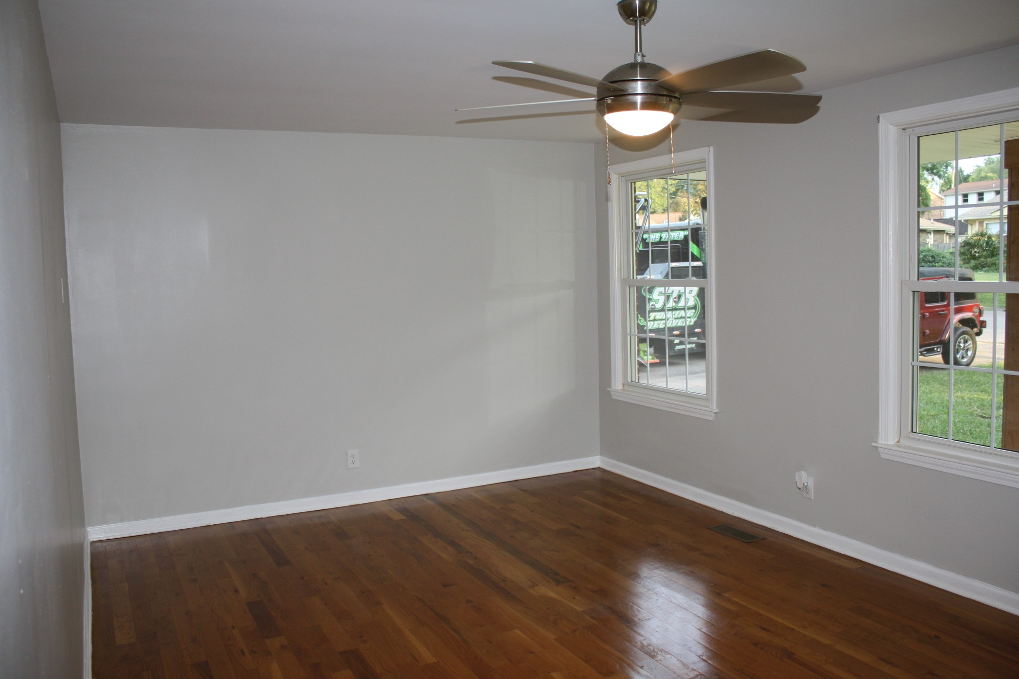 36 Benzing Road Antioch, TN 37013 - Photo 34 of 39 a view of an empty room with wooden floor and windows