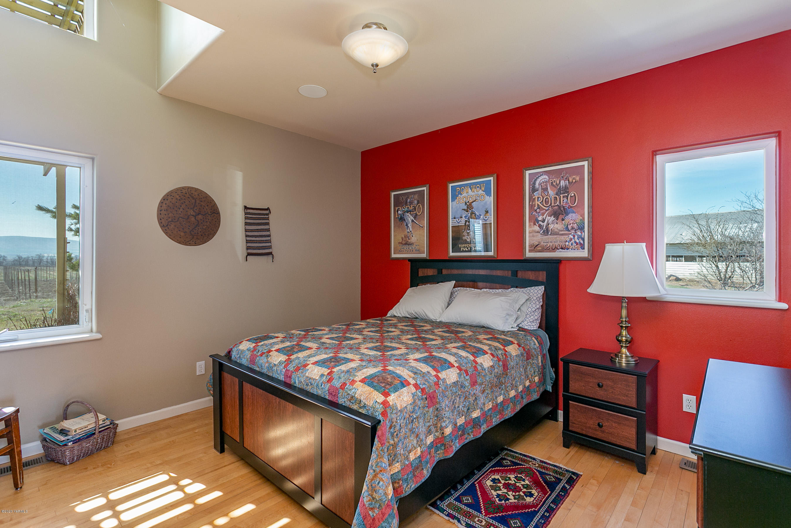 360 Chase Road Grandview, WA 98930 - Photo 22 of 37 a bedroom with a bed and dresser with mirror