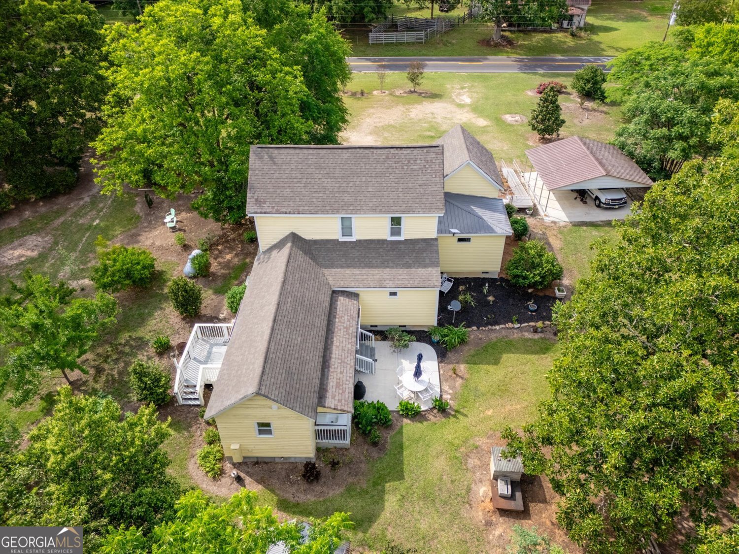 6644 East Cadley Road Norwood, GA 30821 - Photo 52 of 53 an aerial view of a house with swimming pool and outdoor space