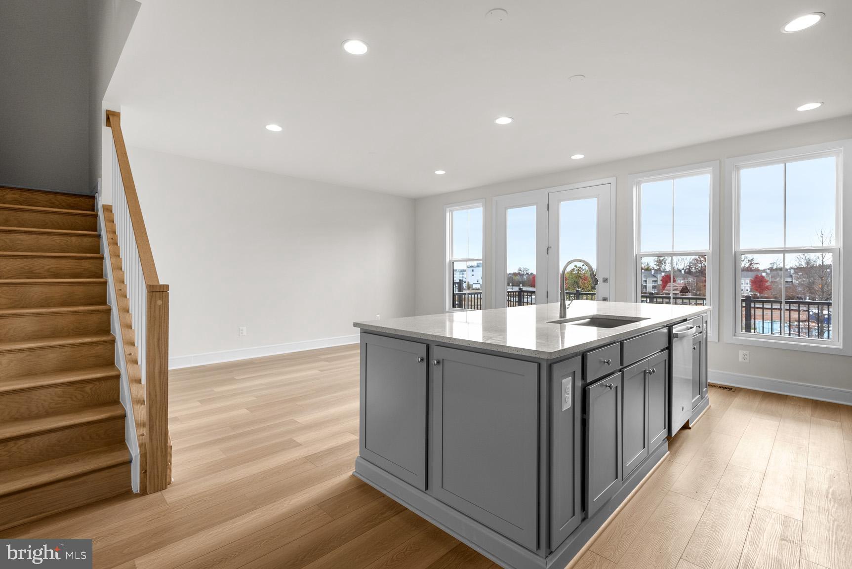43423 Farringdon Square Ashburn, VA 20148 - Photo 12 of 31 a kitchen with stainless steel appliances granite countertop a sink stove and cabinets