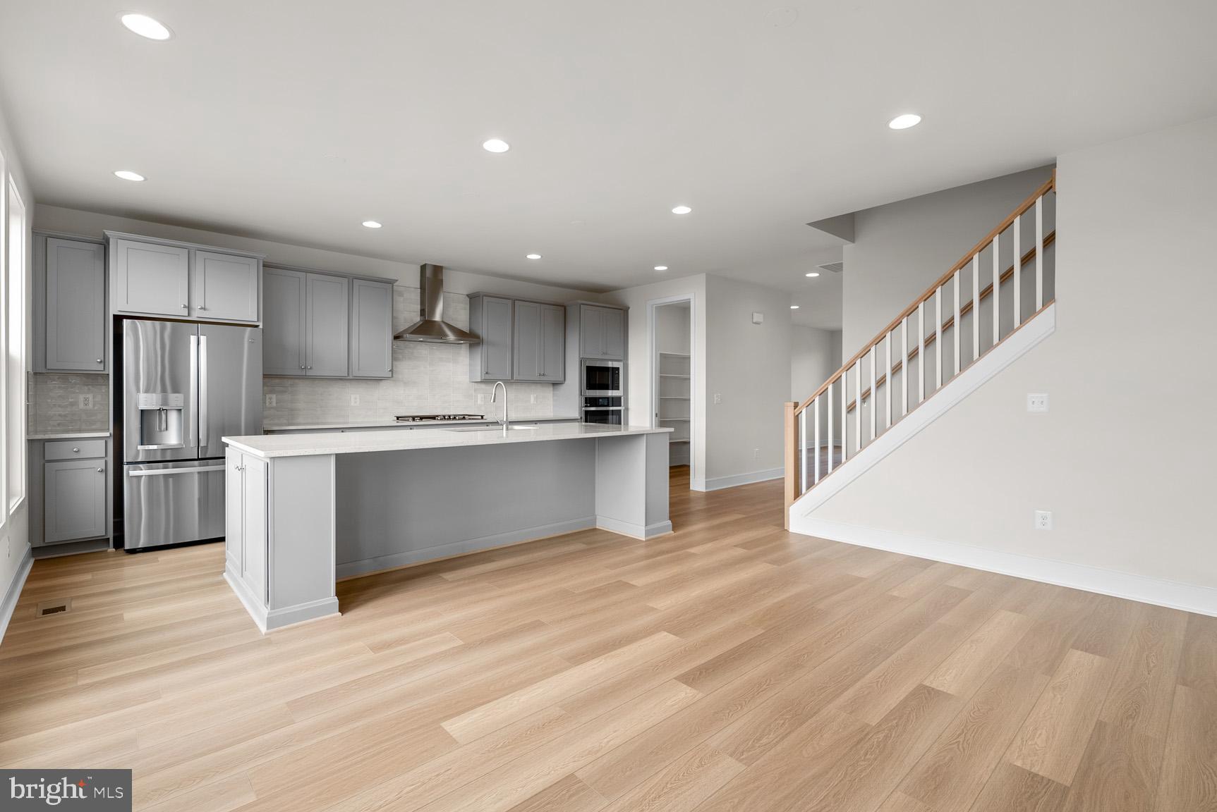 43423 Farringdon Square Ashburn, VA 20148 - Photo 15 of 31 a view of kitchen with wooden floor and electronic appliances