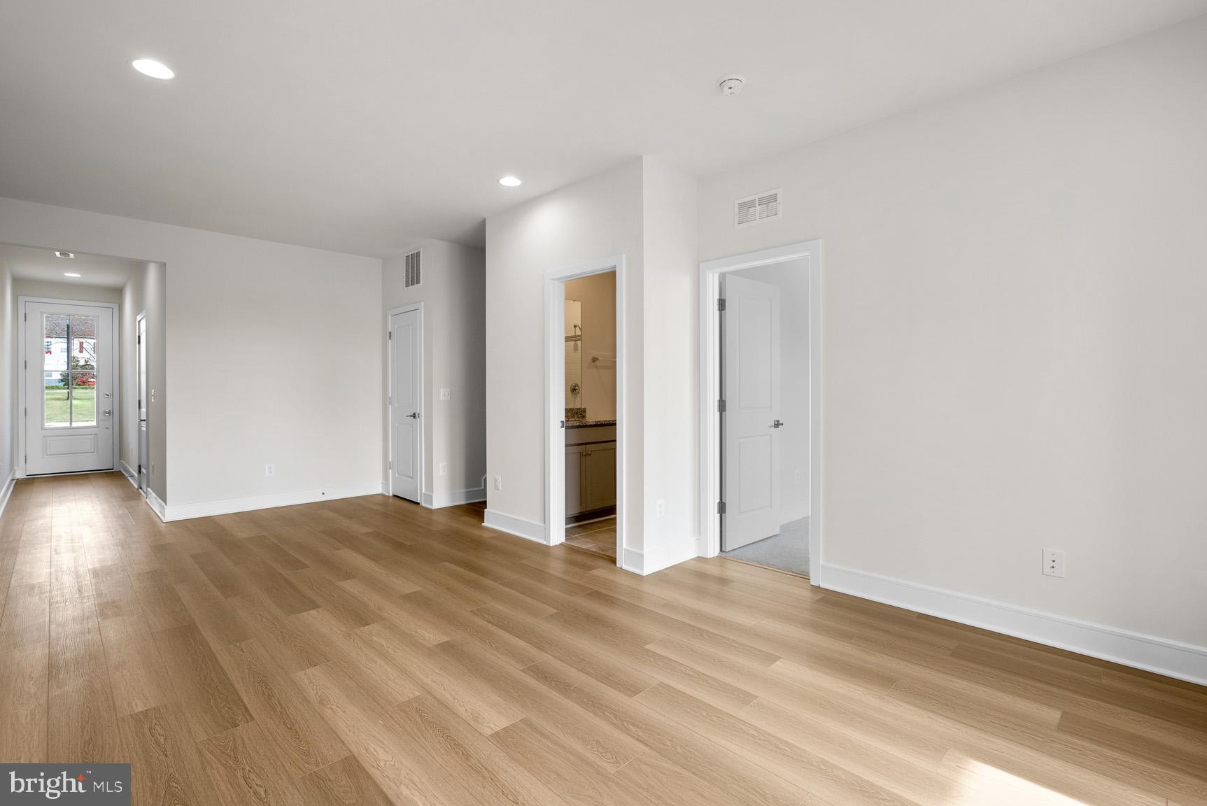 43423 Farringdon Square Ashburn, VA 20148 - Photo 3 of 31 wooden floor in an empty room with a window