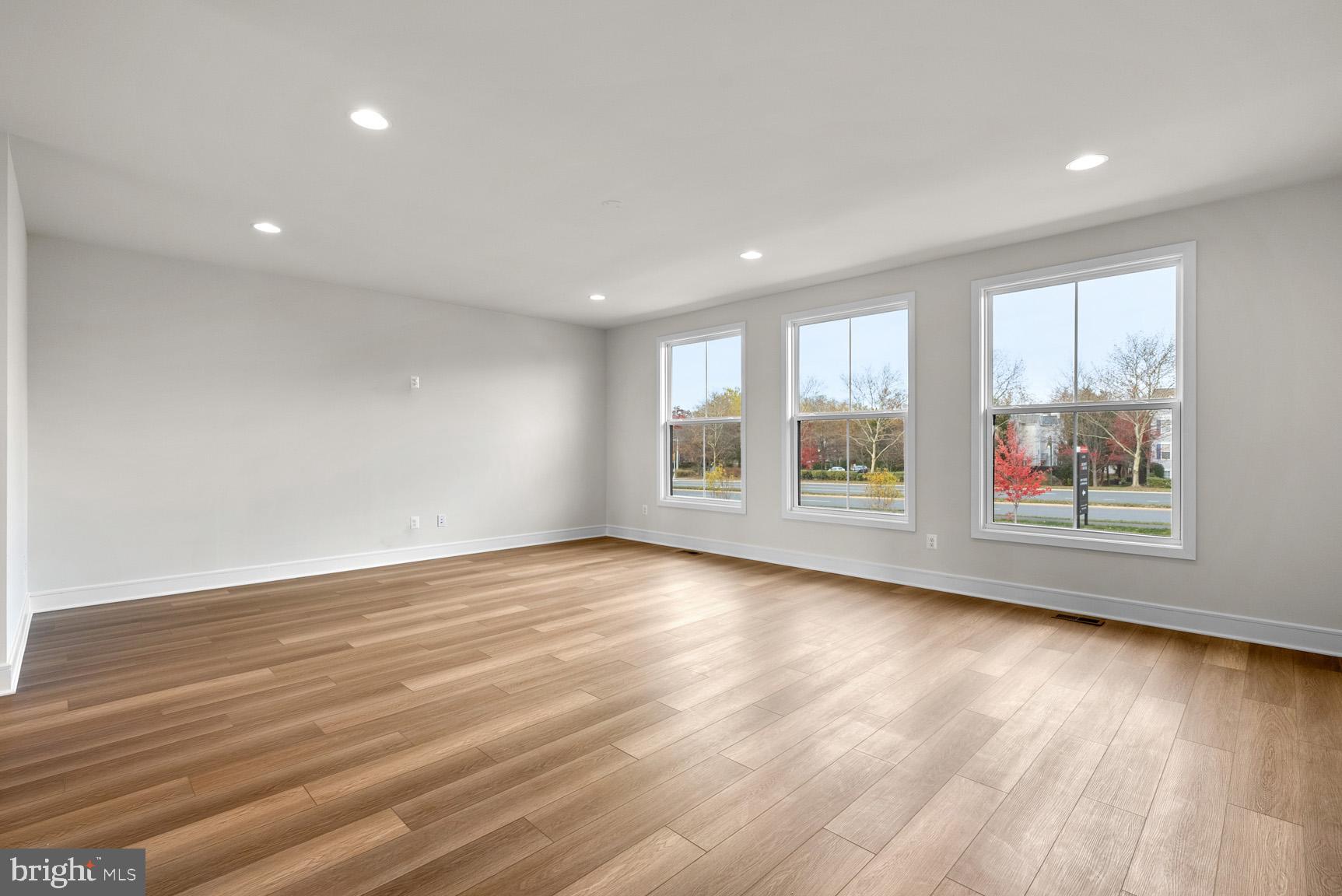 43423 Farringdon Square Ashburn, VA 20148 - Photo 7 of 31 an empty room with wooden floor and windows