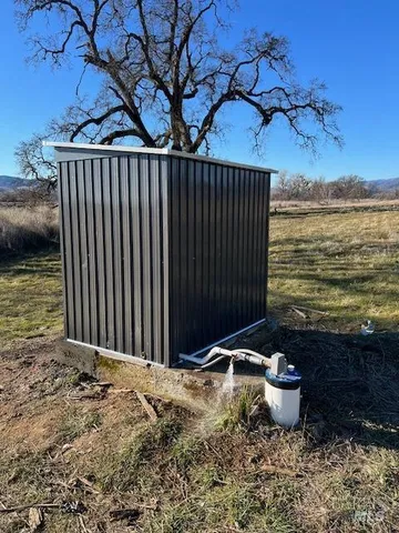 a view of a backyard of the house